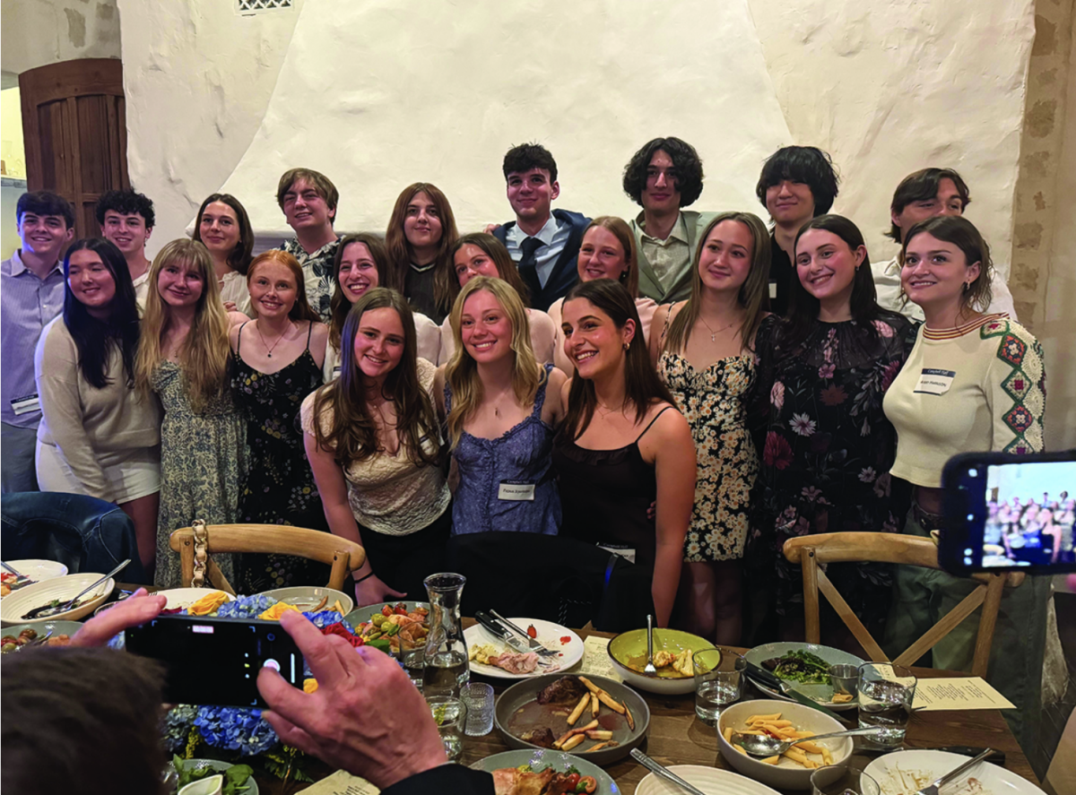 Madeline E. '25 and her fellow thirteen year students pose together at the schools annual Thirteen-Year dinner
